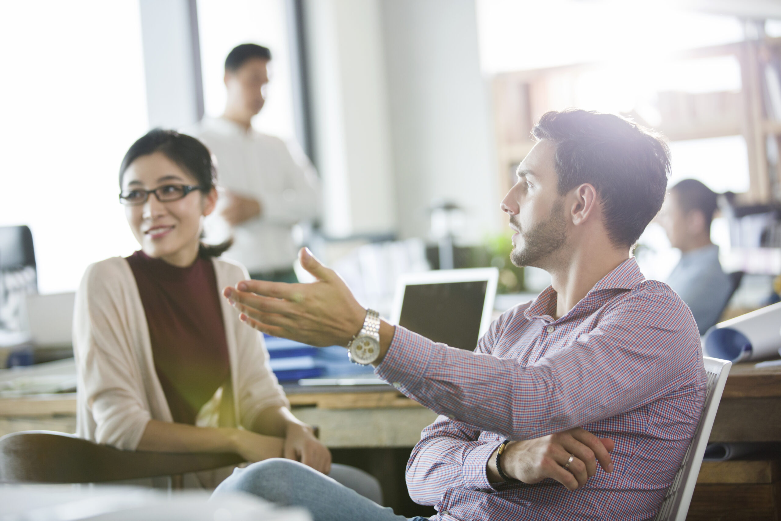 Business development representatives giving feedback to each other