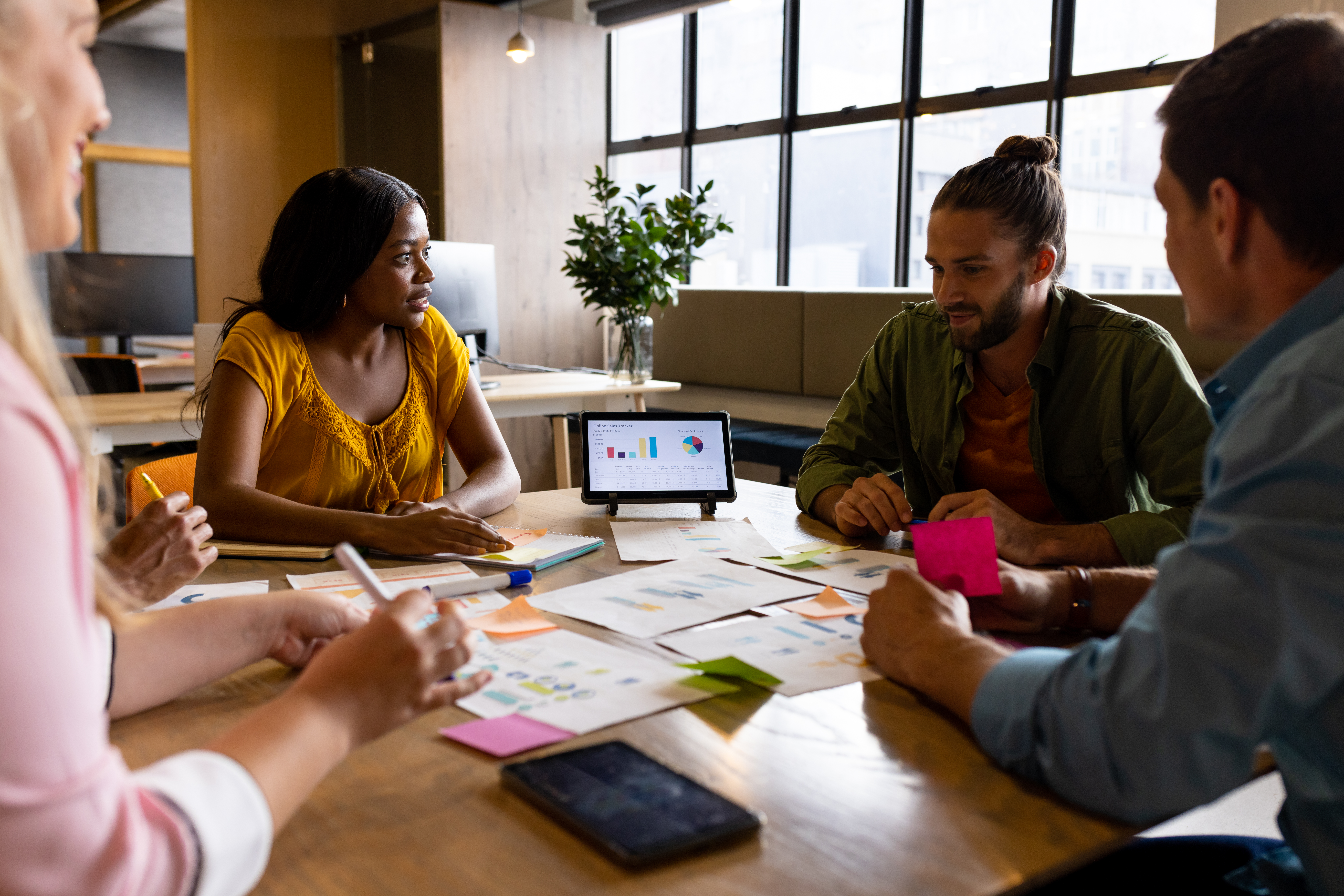 A group of people brainstorming direct marketing strategies